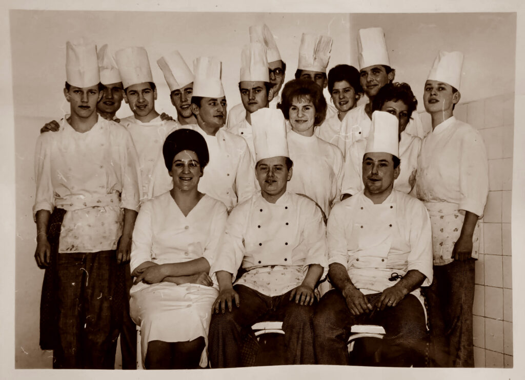 Group photo of chefs in training with their mentors, including Gert.