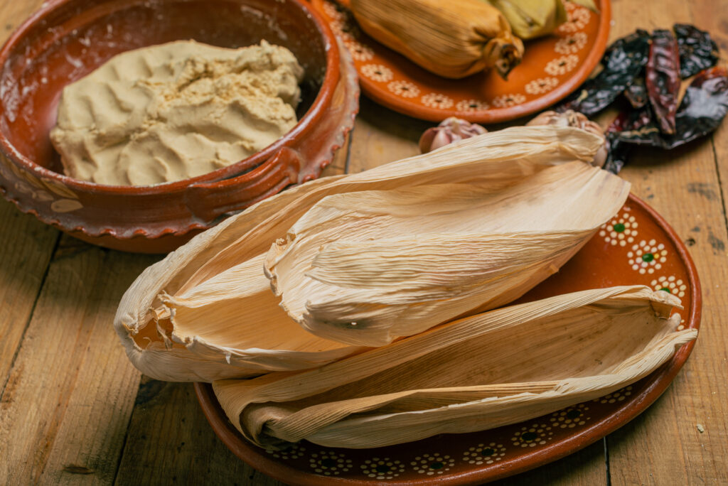 Corn husks and other ingredients to make tamales. Typical Mexican food.