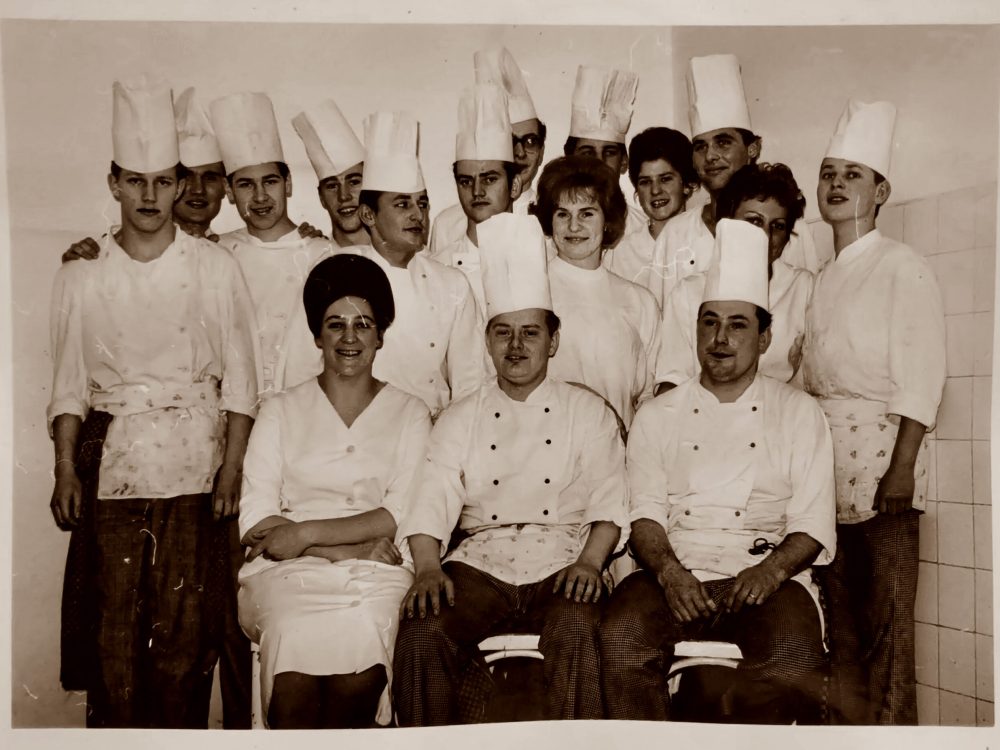 Group photo of chefs in training with their mentors, including Gert.