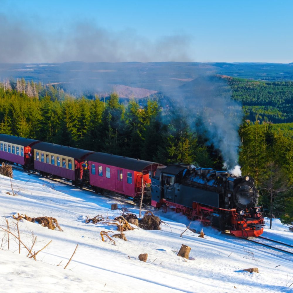 Steam train during winter in the snow in the Harz Germany Brocken Bahn